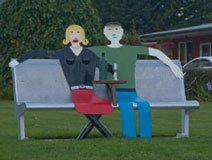 Models of two people sitting on a bench, New Zealand